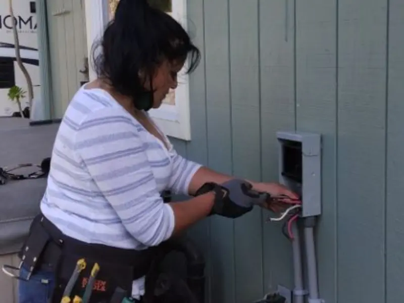 Licensed electrician wiring an exterior subpanel in Sugar Creek